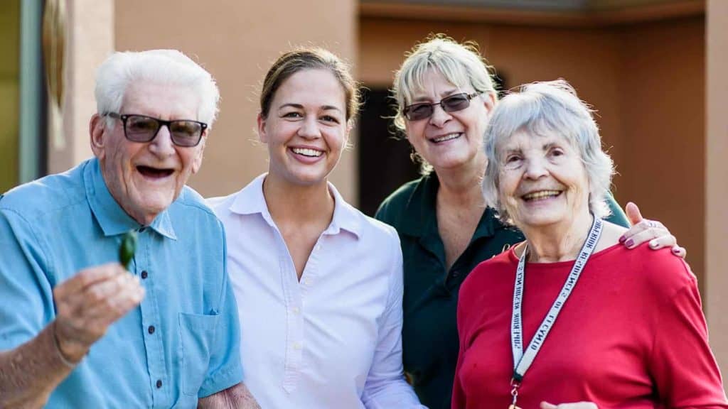 Staff and seniors posing for a photo